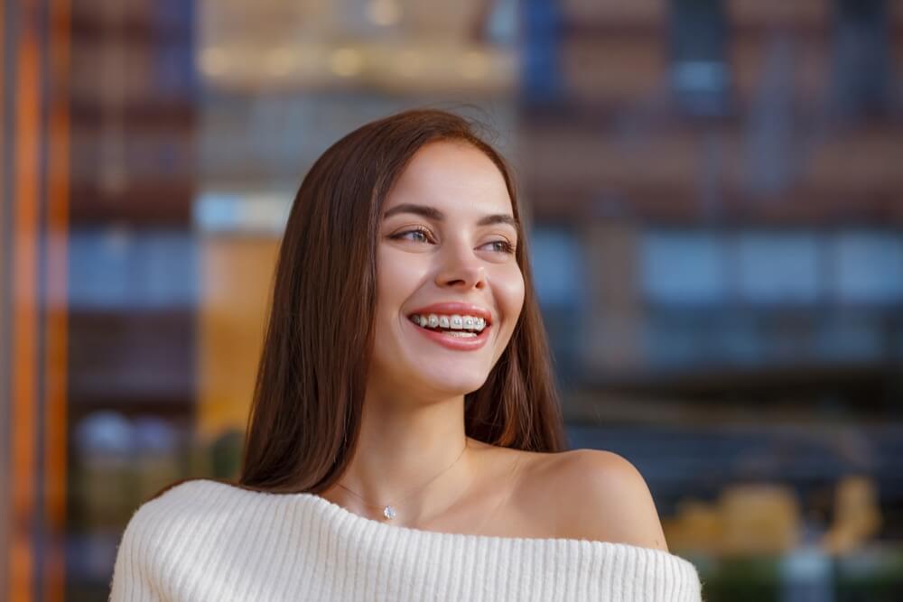 Portrait of a beautiful happy woman with braces